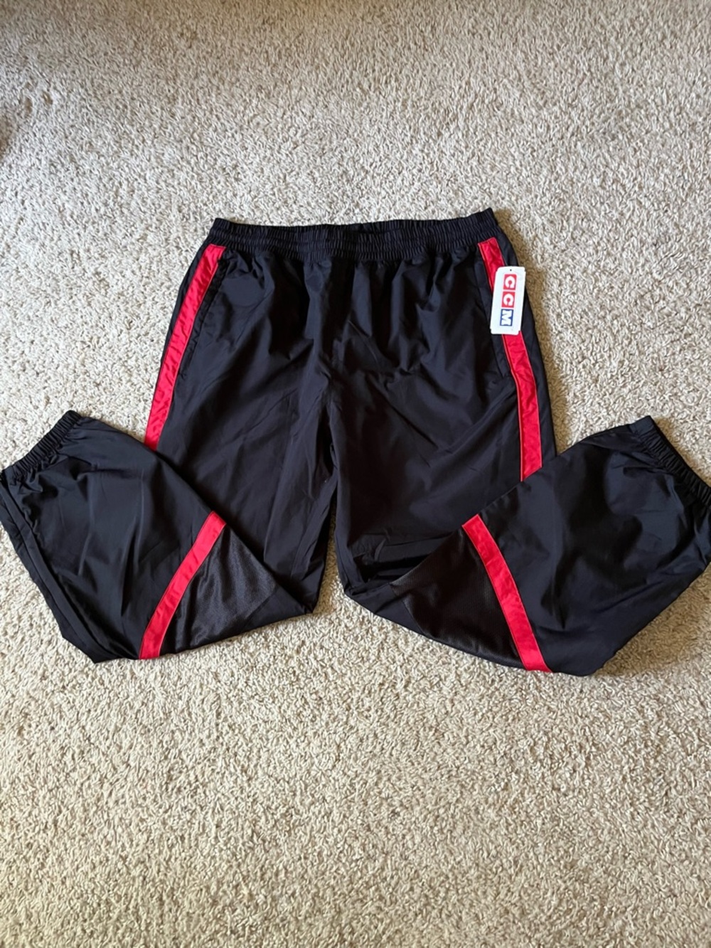 CCM Team-Issued Hockey Warmup Pants in Black and Red